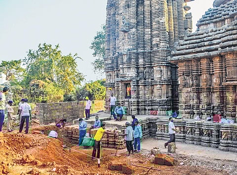 ASI officials cleaning the Sari Deula site, in Bhubaneswar. (Photo | Express)