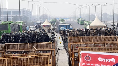 Security personnel keep vigil at Ghazipur border during the ongoing farmers agitation against Centres farm reform laws in New Delhi. (Photo | Praveen Negi/EPS)