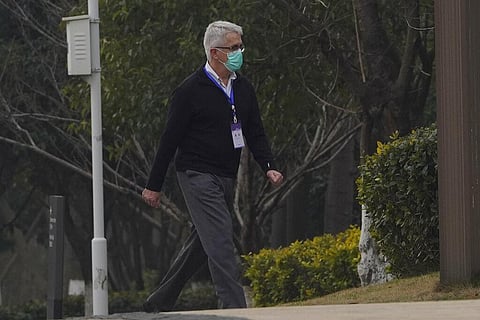 Dominic Dwyer of a World Health Organization team walks in the cordoned hotel area in Wuhan in central China's Hubei province on Thursday. (Photo | AP)