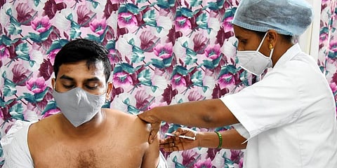 Health workers adminsitering Covishield vaccine to the frontline warriors as part of the second phase of vaccination drive in Tirupati. (Photo | by Madhav K, EPS)