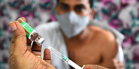 A health worker adminsitering Covishield to the frontline warriors as part of the second phase of vaccination drive in Tirupati. (Photo | Madhav K)