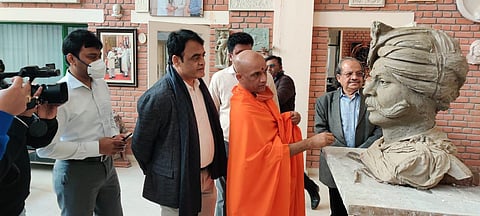 Deputy CM Dr. CN Ashwathnarayana and Swami Nirmalananda Swamiji of Adhichunchungiri mutt checking the progress of the statue. (Photo | EPS)