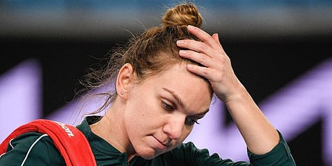 Simona Halep reacts as she leaves the court following her loss to Ekaterina Alexandrova at a tuneup event ahead of the Australian Open in Melbourne. (Photo | AP)