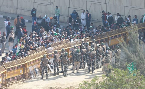 Security personnel stand near barricades at Ghazipur border during the proposed 'chakka jam' by farmers. (Photo | Shekhar Yadav, EPS)