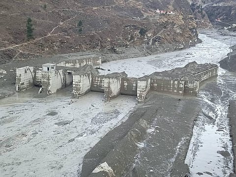 Damaged Dhauliganga hydropower project after a glacier broke off in Joshimath causing a massive flood in the Dhauli Ganga river in Chamoli district of Uttarakhand. (Photo | PTI)