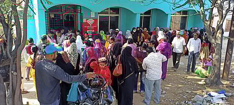 Beneficiaries waiting in queue at a MeeSeva Kendra in Nanal Nagar to get their Aadhaar Cards linked with phone number on Monday. (Photo | R V K Rao, EPS)