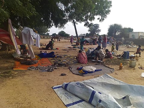 In this July 30, 2020 file photo, residents displaced from a surge of violent attacks squat on blankets and in hastily made tents in the village of Masteri in west Darfur, Sudan. (Photo | AP)