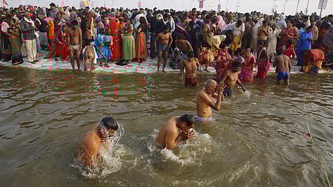 Hindu devotees take spiritual-cleansing dips in the Sangam, the confluence of the Ganges, Yamuna, and the mythical Saraswati rivers during the Kumbh Festival