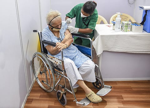 An elderly person being administered the COVID-19 vaccine, during a countrywide inoculation drive, at BKC jumbo vaccination centre in Mumbai, Monday. (Photo | PTI)