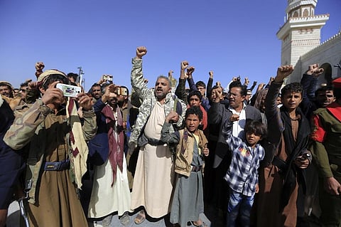 Fighters loyal to Yemen's Huthi rebels chant slogans at the funeral of fellow combatants killed in battles with Saudi-backed government troops on Feb 28. (Photo | AFP)