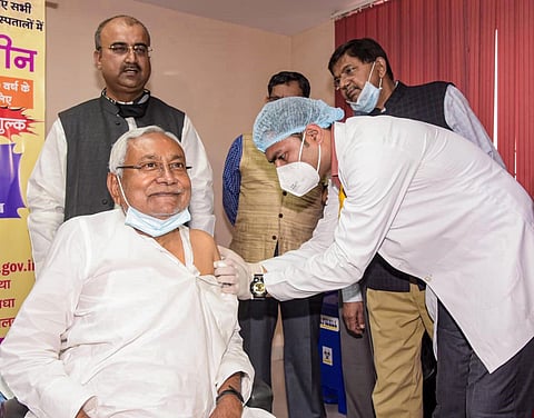 A medic administers the first dose of COVID-19 vaccine to Bihar CM Nitish Kumar, during the 2nd phase of a countrywide inoculation drive in Patna on Monday. (Photo | PTI)