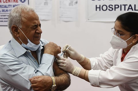 An elderly person being administered the COVID-19 vaccine during a countrywide inoculation drive at the Rajiv Gandhi Super Speciality hospital in New Delhi. (Photo | Parveen Negi, EPS)