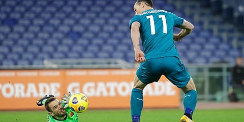 AC Milan's Zlatan Ibrahimovic attempts to score a goal with a back heel shot but is denied by Roma's goalkeeper Pau Lopez. (Photo | AP)