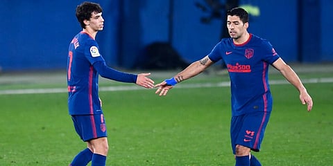 Atletico Madrid's Joao Felix (L) celebrates with Luis Suarez after scoring his side's second goal against Villarreal. (Photo | AP)