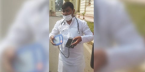 RJD MLA Mukesh Raushan with a BP meter in Assembly day after Nitish Kumar lost his cool at ab opposition leader. (Photo | Express)