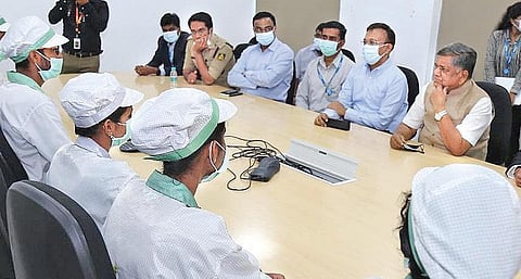 Industries Minister Jagadish Shettar speaks to Wistron’s staff and officials during his visit to the company’s facility at Narasapura Industrial Area in Kolar district on Wednesday | Express