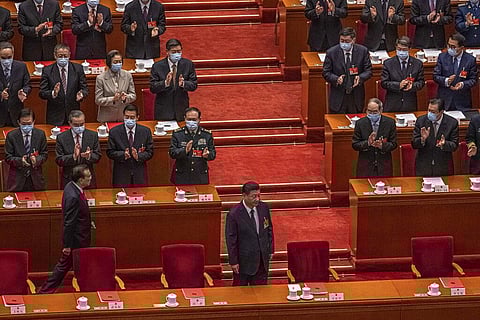 Chinese President Xi Jinping, bottom center, and Premier Li Keqiang, bottom left, arrive for the closing session of the National People's Congress (NPC), at the Great Hall of the People. (Photo | AP)