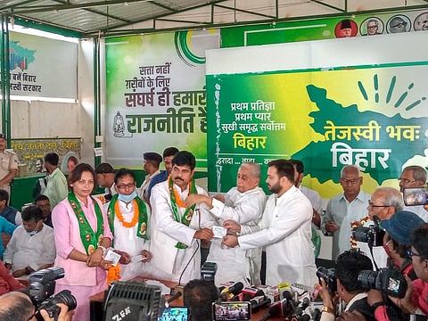 Leader of the RJD Tejashwi Yadav welcoming all those who joined the party on Friday. (Photo | Special arrangement)