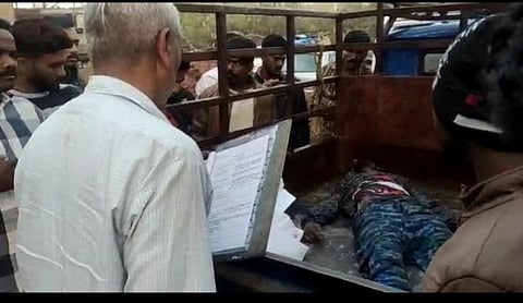 Police and locals surround dead body of Mubarak Khan who was beaten to death over suspicion of bike theft in Jharkhand's Sirka village. (Photo | Express)