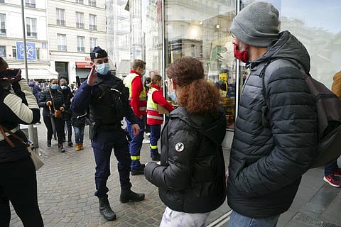 A police officer patrols in the Chatelet area amidst the new coronavirus pandemic, in Paris. (Photo | AP)