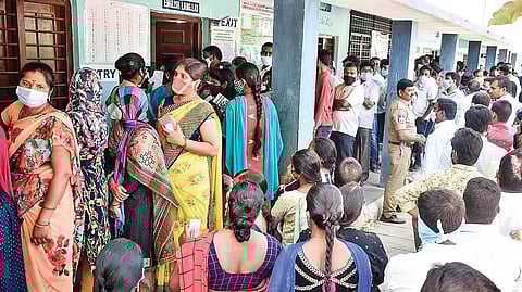 Scores of graduates wait in long queues to cast votes in the MLC poll, at Ibrahimpatnam, Hyderabad, on Sunday.