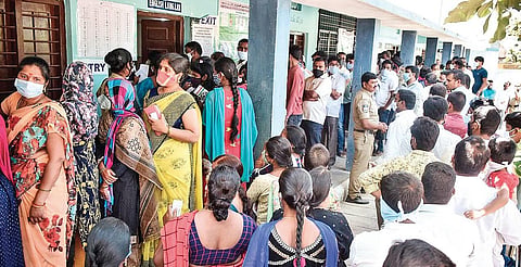 Scores of graduates wait in long queues to cast votes in the MLC poll, at Ibrahimpatnam, Hyderabad, on Sunday | VINAY MADAPU