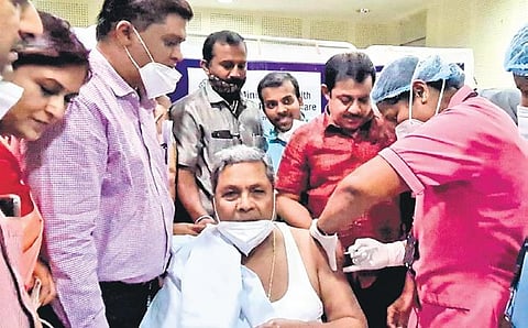 Leader of the Opposition Siddaramaiah, who recovered from Covid-19 in August 2020, gets the jab at Victoria Hospital in Bengaluru on Monday | Express