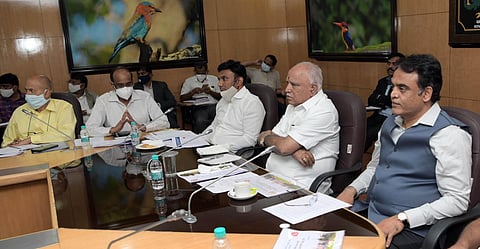 Chief Minister B S Yediyurappa, DyCM C N Ashwath Narayan and Health Minister Dr K Sudhakar at the Covid review meeting, in Bengaluru on Monday | EXPRESS