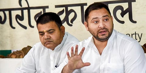 Rashtriya Janata Dal leader Tejashwi Yadav addresses a press conference at his residence, in Patna on Wednesday. (Photo | PTI)