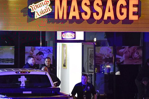 Authorities investigate a fatal shooting at a massage parlor, late Tuesday, March 16, 2021, in Woodstock, Ga. (Photo | AP)