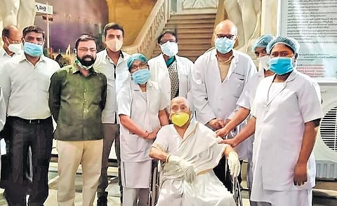 A 108-year-old lady woman poses with doctors after taking the Covid-19 vaccine at Koti ENT Hospital in Hyderabad on Wednesday.