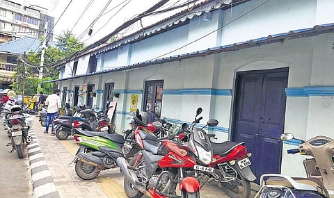 Two wheelers parked on the footpaths along Hospital Road. This has forced patients and visitors to the General Hospital to walk on the main road, endangering their safety | express