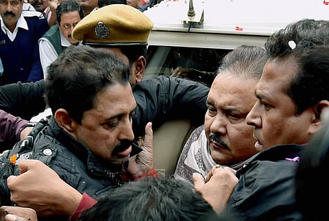 West Bengal Transport and Sports Minister Madan Mitra arrested by the CBI in connection with Saradha chit fund scam being produced at a local court. (File | PTI)