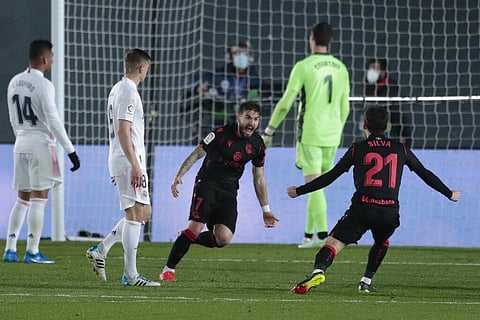 Real Sociedad's Portu, center, celebrates with teammate Real Sociedad's David Silva after scoring against Real Sociedad at Alfredo di Stefano stadium in Madrid, Spain, Monday. (Photo | AP)