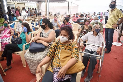 Senior citizens wait to receive the first dose of COVID-19 vaccine during the second phase of a countrywide inoculation drive at BKC in Mumbai Tuesday March 2 2021. (Photo | PTI)