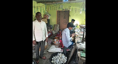 Pramod Baitha (L) at his LED bulb factory that he started at his home in West Champaran, Bihar (Photo | Express)