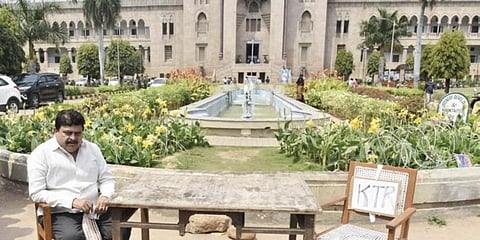 Seated in front of Arts College in Osmania University, BJP leader Ramchander Rao waits for TRS working president KT Rama Rao for a debate on employment.