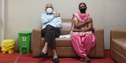 Senior Citizens sits under observation after getting his first dose of COVID-19 vaccine during the second phase of the countrywide inoculation drive in New Delhi. (Photo | Parveen Negi, EPS)