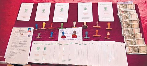 Ramagundam Commissionerate police seized fake pass books and stamps including cash from accused person who made for bank loans in Peddapalli district. (Photo| EPS)