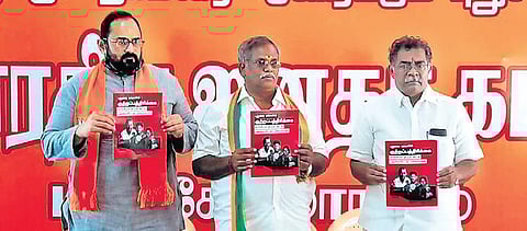 MP Rajeev Chandrasekhar and State General Secretary Embalam R Selvam releasing a ‘chargesheet’ against the V Narayanasamy government, in Puducherry | express