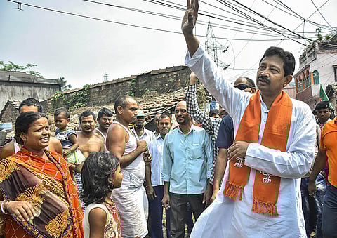 BJP leader Rajib Banerjee during his door-to-door campaign for West Bengal Assembly polls, in Howrah district, Sunday. (Photo | PTI)
