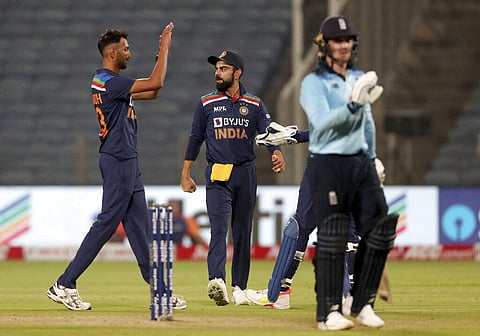 India's Prasidh Krishna, left, and teammates celebrate the dismissal of England's Jason Roy, right, during the first ODI. (Photo | AP)