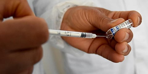 A health worker loads a syringe with a shot of the Sputnik-V COVID-19 vaccine. (Photo | AP)