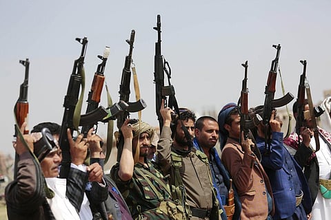 In this Aug. 22, 2020 file photo, tribesmen loyal to Houthi rebels raise their weapons during a protest against the agreement to establish diplomatic relations between Israel and the UAE. (Photo | AP)