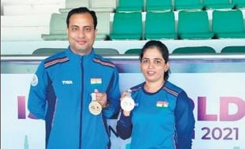 Sanjeev Rajput (L) & Tejaswini Sawant won the 50m rifle 3P mixed team event | Express