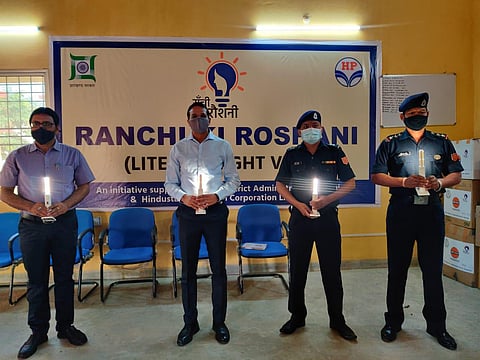 NDRF personnel being handed over solar lamps built by self help groups in Ranchi. (Photo | Express)