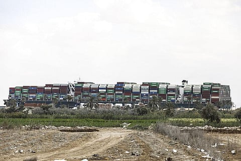 Ever Given, a Panama-flagged cargo ship, that is wedged across the Suez Canal and blocking traffic in the vital waterway. (Photo | AP)