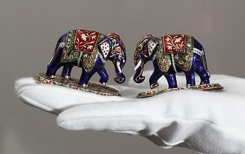 A pair of jewelled gold elephants from Jaipur mid 20th century, on view at Sotheby's auction house in London, Friday, March 19, 2021. (Photo | AP)