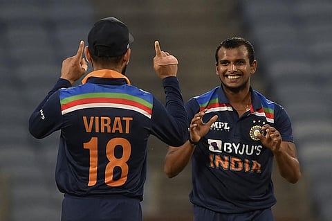India's T Natarajan (R) celebrates after taking wicket during final ODI match against England at MCA Stadium in Pune on March 28, 2021. (Photo | AFP)