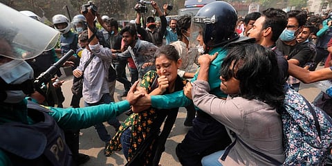 Bangladeshi students clash with police during a protest in Dhaka, Bangladesh. (Photo | AP)